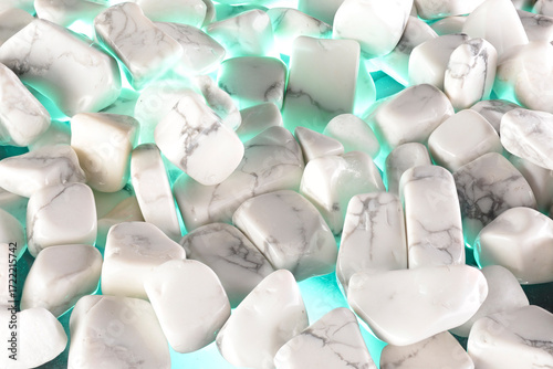 White polished stones texture background and green light