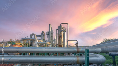 Geothermal power plant pipes at sunset in Larderello, Tuscany region, Italy