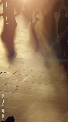 Silhouetted Figures in Motion at a Busy and Bustling Terminal Filled with Activity