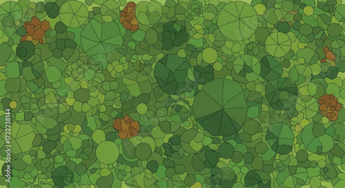 Aerial view of a dense forest canopy with green trees and brown clusters scattered throughout it