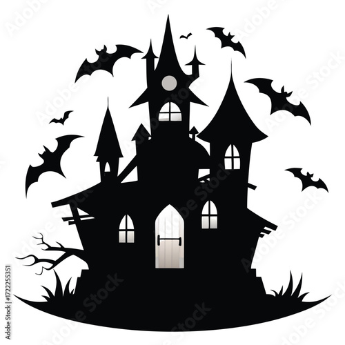 Silhouette of a haunted house with bats flying around