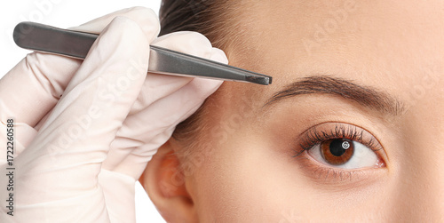 Young woman undergoing eyeb...