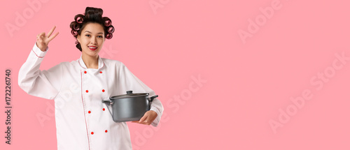 Female Asian chef with hair...