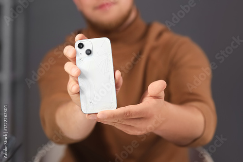 Male technician with broken...