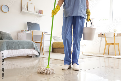 Janitor with mop and bucket...