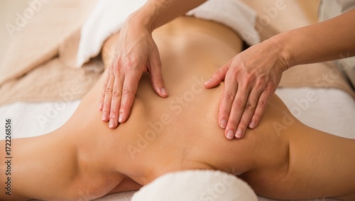 Wallpaper Mural Woman enjoying a relaxing back massage, focusing on wellness and self care, receiving professional spa therapy for pain relief and physical comfort Torontodigital.ca