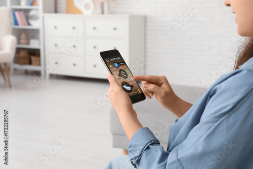 Young woman using mobile ph...