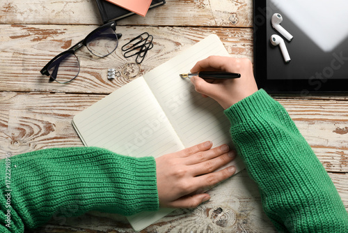 Female hands with notebook,...