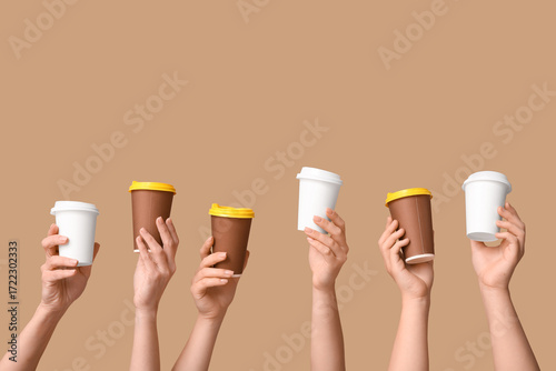 Multiple hands holding asso...