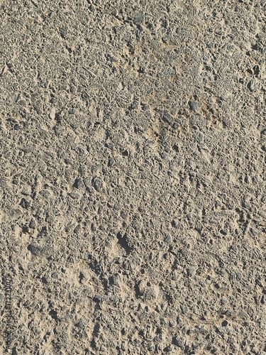 asphalt road construction has some smooth parts and holes, portrait shots