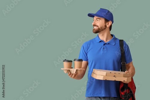 Male courier with pizza box...