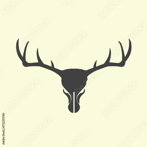 Vector art of stylized silhouette of a deer skull with large antlers on a light yellow background