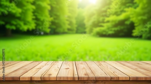 Display your product on this light wooden table with a lush green meadow background