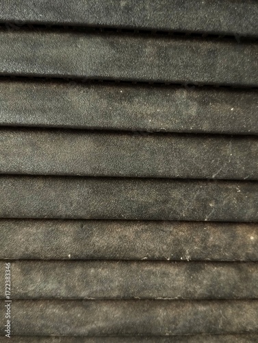 A pleated blind or a similar textured surface like folded paper
