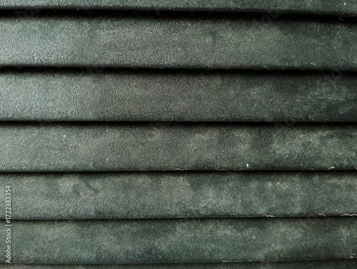 A pleated blind or a similar textured surface like folded paper