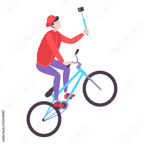 Young man on a bicycle doing a wheelie while filming himself with a selfie stick for his vlog