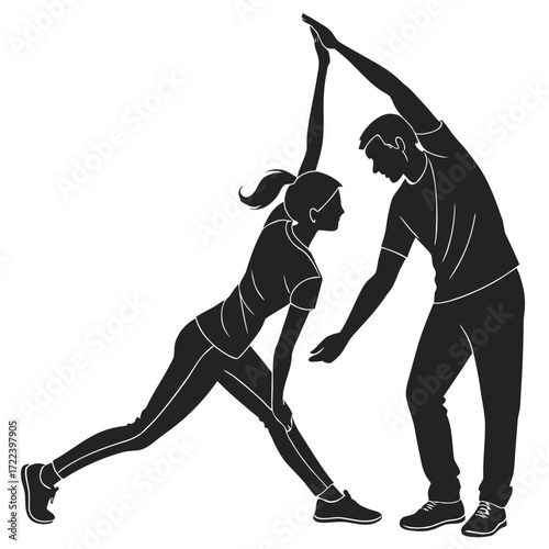 Silhouette of a man and woman performing a stretching exercise together demonstrating teamwork and fitness