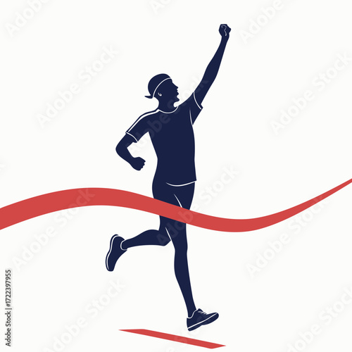 Silhouette of a triumphant runner crossing the finish line with arm raised in celebration of victory