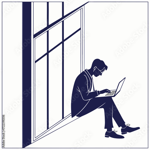 Silhouette of a man in a suit wearing glasses working on a laptop while sitting on a windowsill with a modern window frame