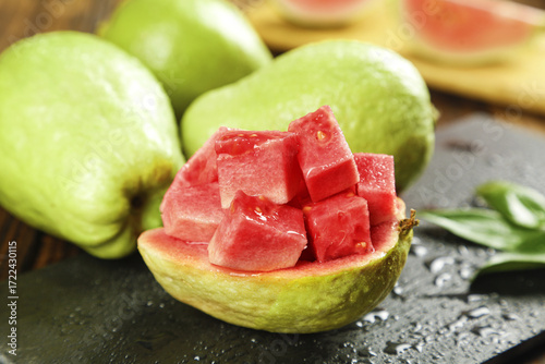 Fresh Guava Fruit Cubes on Wood - Tropical Asian Fruit with Pink Flesh