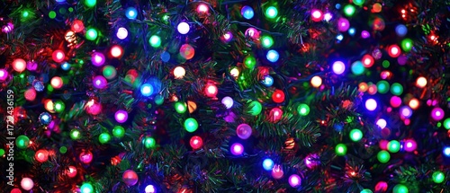 Vibrant colorful lights adorning artificial evergreen tree festive celebration holiday decoration glowing bright