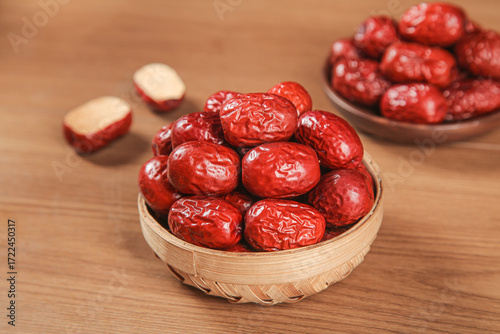 Hotan Red Jujube Dates from Xinjiang China in Bamboo Baskets on Wood Table