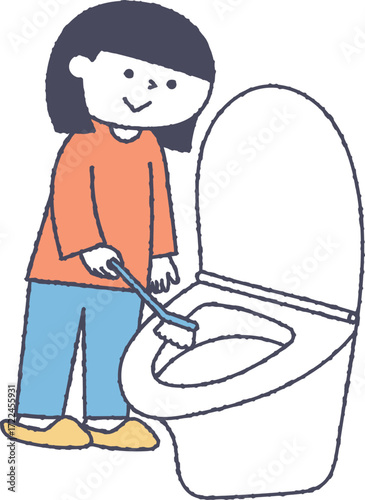 トイレをブラシで掃除する女の子