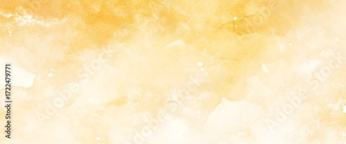 Abstract watercolor wash of warm golden yellow and soft orange hues creating a textured artistic background with a gentle gradient effect for creative design projects