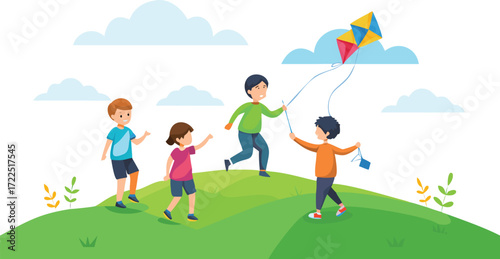 Children joyfully flying a colorful kite on a grassy hill under a clear blue sky.