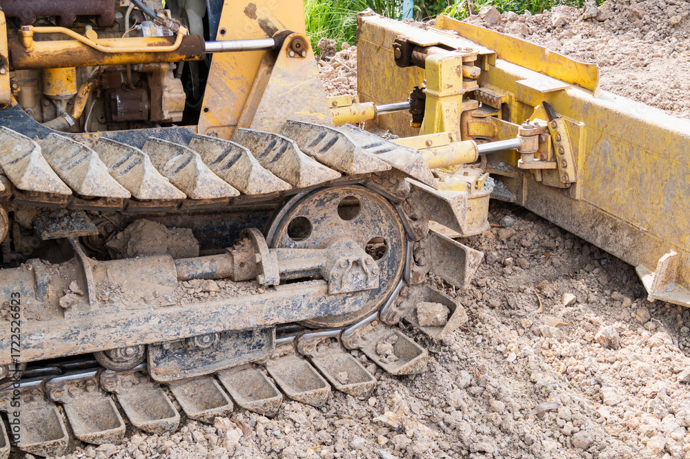 Fototapeta premium Construction machinery moving earth outdoor site industrial equipment urban environment close-up view earthwork process