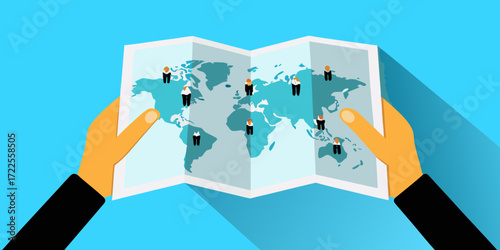 Hands holding world map with diverse people standing on different continents representing global business
