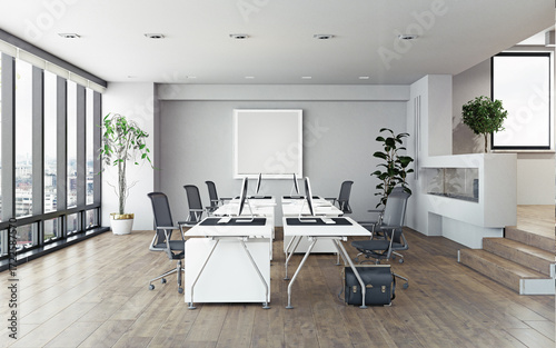 Modern office interior with empty desks and computers. Bright corporate workplace with a city view. 3D rendering of a co-working space.