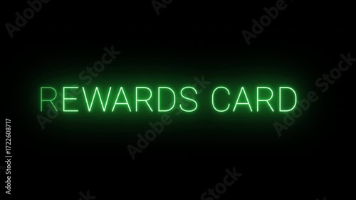 Flickering neon green Rewards card sign animated on black background.