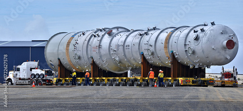 Huge refinery vessel is loaded onto a transporter multi wheeled vehicle at Barry Beach Marine Terminal, in south east Victoria.