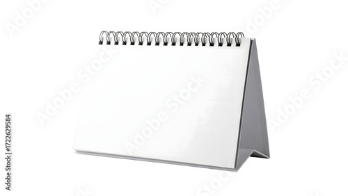 A blank desk calendar with a silver spiral binding stands isolated on a white background.
