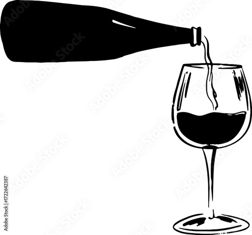 A bottle pours red wine into a stemmed glass