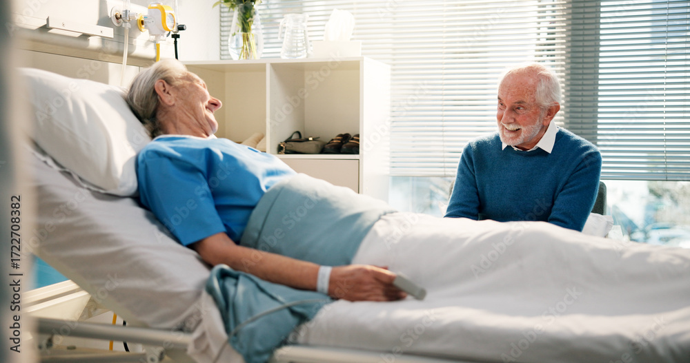 Obraz premium Talking, visit and senior woman in hospital with husband for bonding, support or care in recovery. Medical appointment, marriage and elderly female patient in ward bed for consultation in clinic.