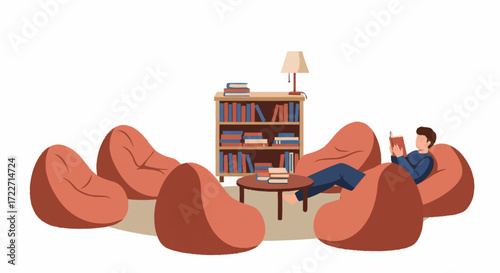 Man reading a book in a cozy library beanbag seating area.