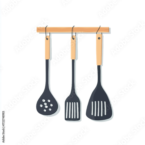 Collection of essential kitchen cooking utensils on a wall rack
