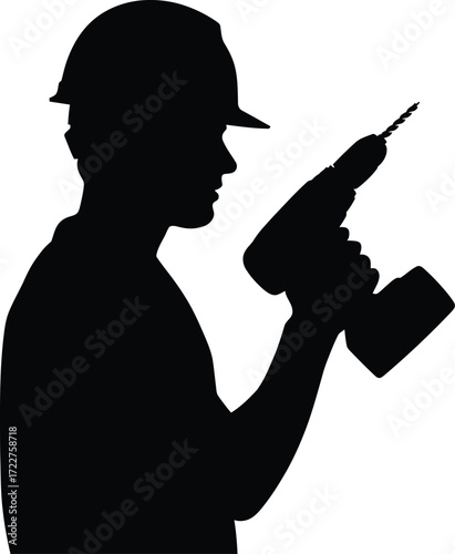 Silhouette of a construction worker holding a power drill ready for work