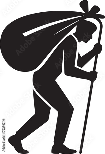Silhouette of a person carrying a large bundle on a stick traveling nomadically
