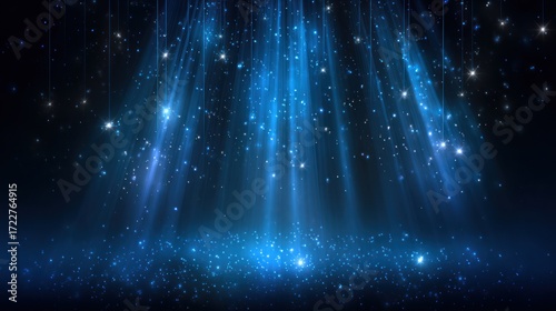 Blue light streams down into a dark space filled with scattered glitter particles