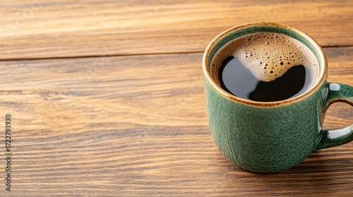 Warm Green Coffee Mug on Rustic Wooden Table with Coffee Inside
