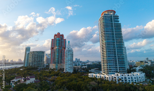 Miami Beach on blue sky. Skyline aerial view. Miami city. Tropical Miami scene. Miami district sky view. Famous oceanfront. Panoramic coastline.