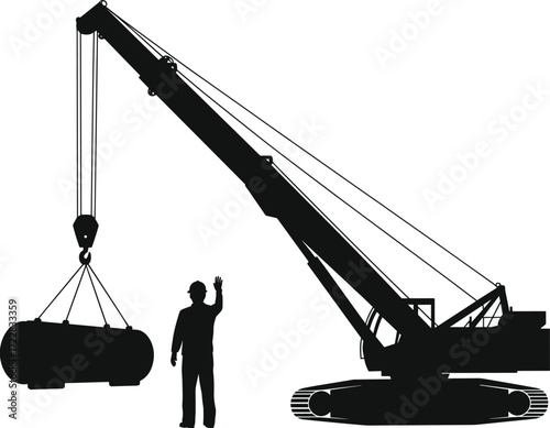 Silhouette of heavy construction crane lifting industrial load with worker guiding operation, safety teamwork and machinery control at building site
