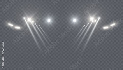 Bright white spotlights with intersecting beams of light on a transparent background. A realistic stage lighting effect for concerts, theaters, fashion shows, and digital design compositions.