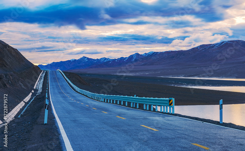 Snow capped mountains, plateau highways, and pastures in the western mountainous areas of Sichuan, China On September 30th, 2024