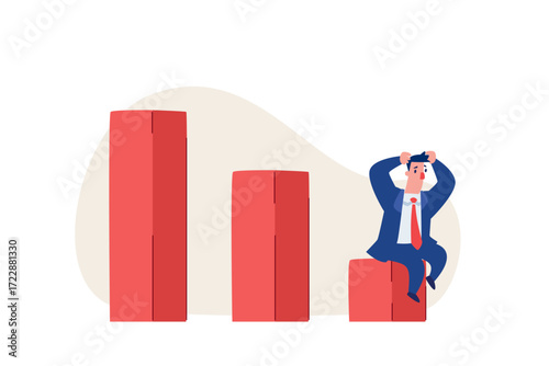 stressed businessman sitting on the lowest declining bar chart