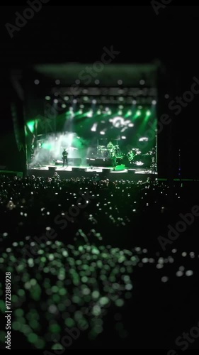 A vibrant concert scene with a lively crowd awaits an unforgettable show