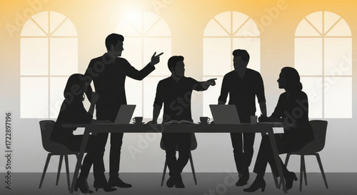 Silhouette of a business meeting with people around a table with laptops and cups in an office space